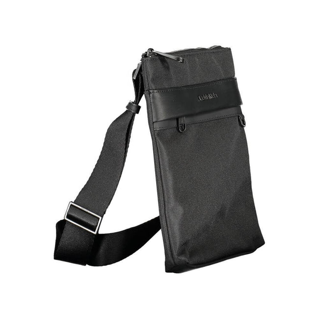Black Polyester Shoulder BagADJUSTABLE SHOULDER STRAP, 1 EXTERNAL POCKET, 1 INTERNAL POCKET, CONTRASTING DETAILS, ZIP CLOSURE, LOGO, 100% RECYCLED POLYESTERBlack Polyester Shoulder Bag${tagsCalvin KleinAulae Black Polyester Shoulder Bag Calvin KleinAulae
