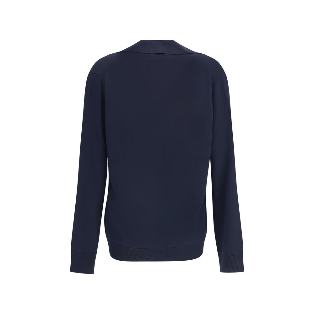 Blue Wool SweatshirtThe Gucci polo Sweater combines relaxed elegance and iconic details. Crafted with a relaxed fit, it features a classic collar and a deep V-neckline that enhance its casual-chic silhouette. The design is completed by long sleeves, ribbe