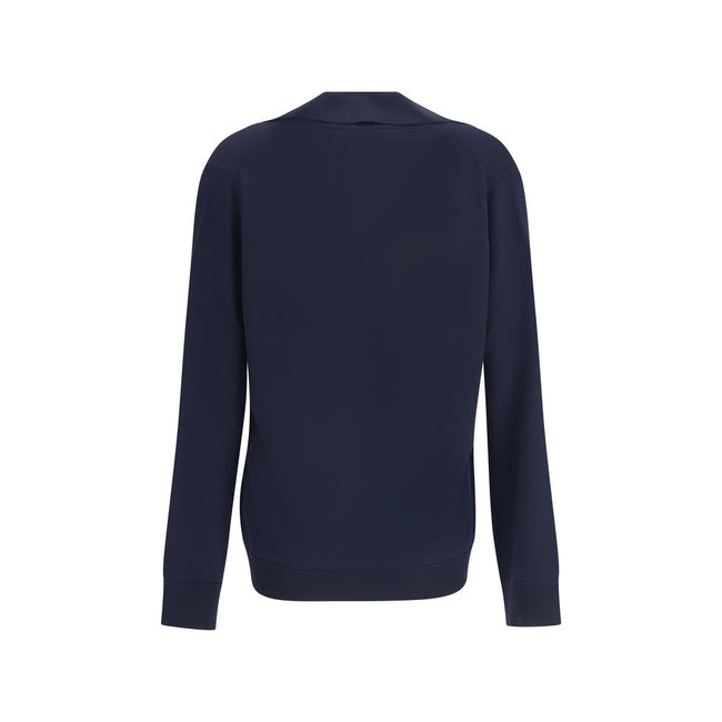 Blue Wool SweatshirtThe Gucci polo Sweater combines relaxed elegance and iconic details. Crafted with a relaxed fit, it features a classic collar and a deep V-neckline that enhance its casual-chic silhouette. The design is completed by long sleeves, ribbe