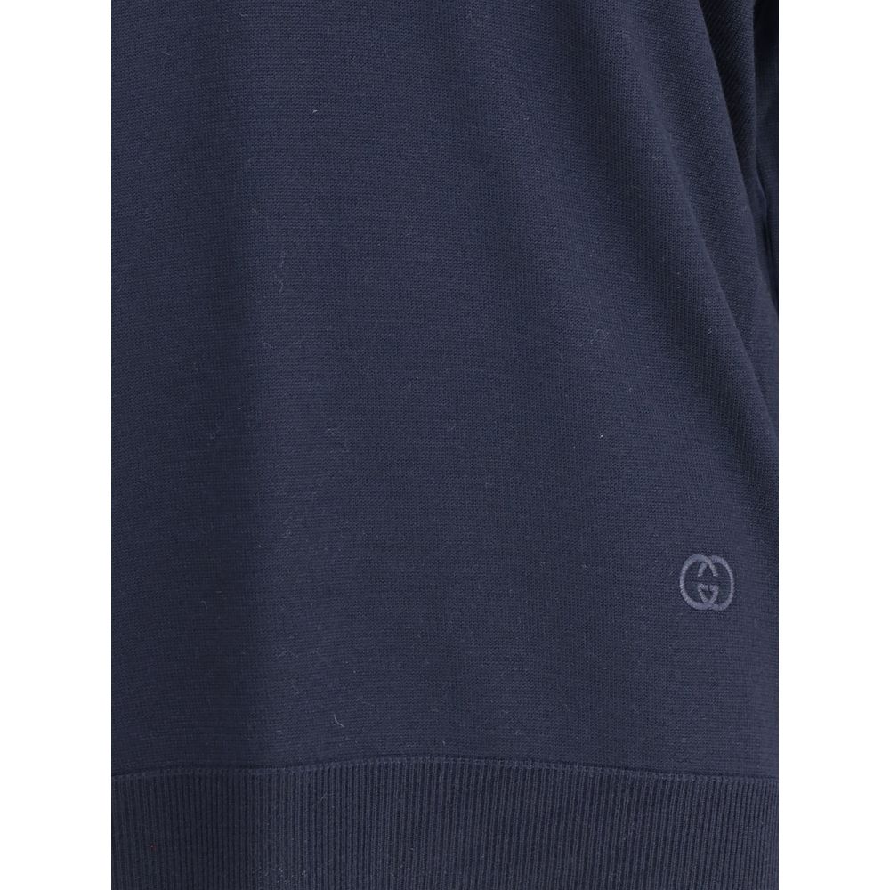 Blue Wool SweatshirtThe Gucci polo Sweater combines relaxed elegance and iconic details. Crafted with a relaxed fit, it features a classic collar and a deep V-neckline that enhance its casual-chic silhouette. The design is completed by long sleeves, ribbe