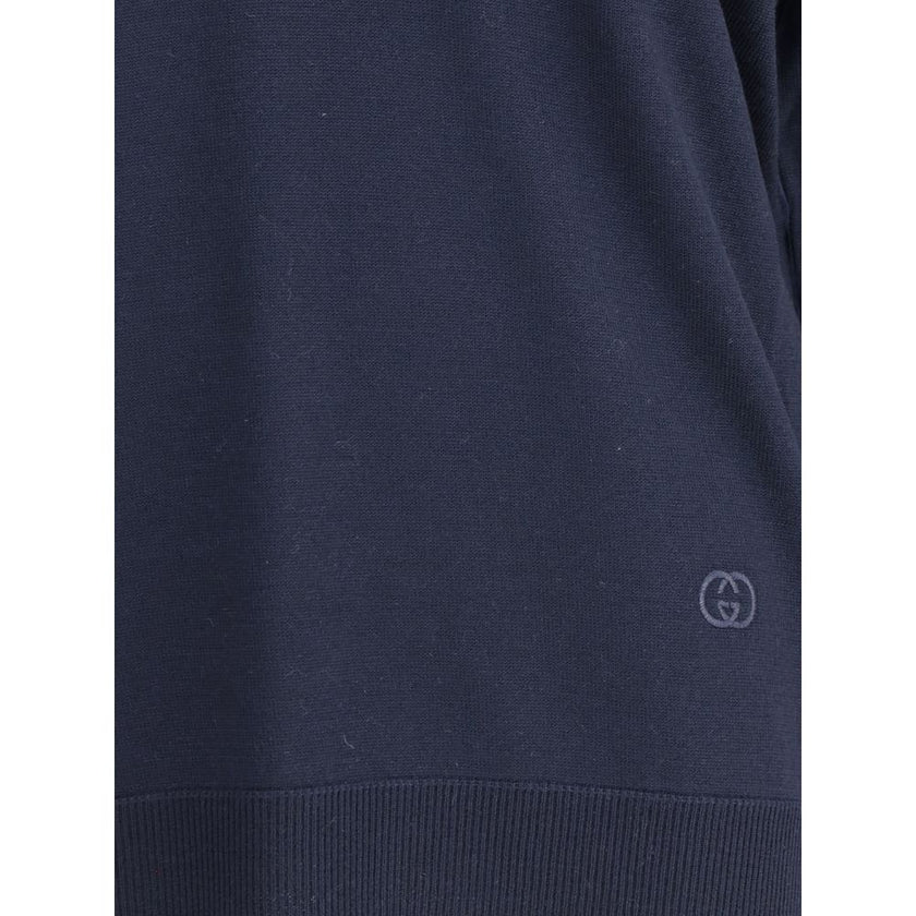 Blue Wool SweatshirtThe Gucci polo Sweater combines relaxed elegance and iconic details. Crafted with a relaxed fit, it features a classic collar and a deep V-neckline that enhance its casual-chic silhouette. The design is completed by long sleeves, ribbe