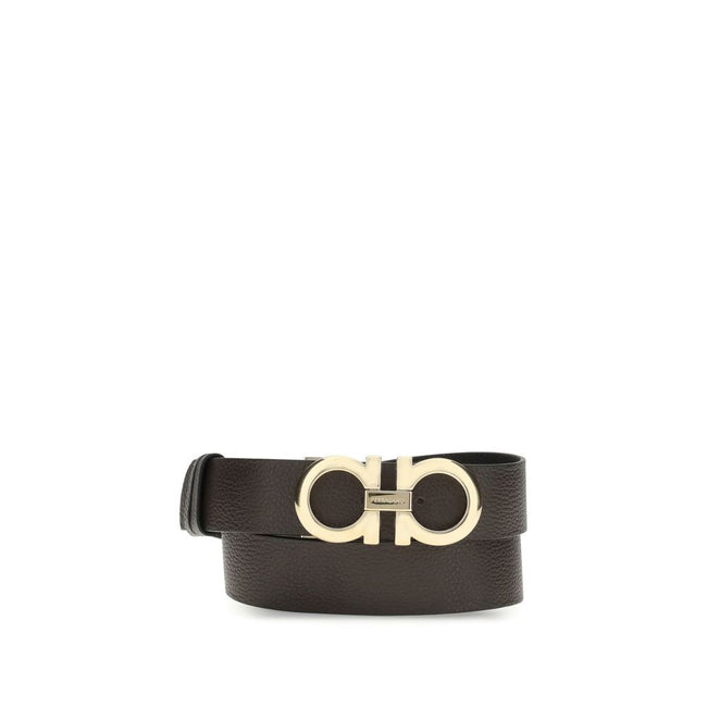 Brown Calf Leather Bos Taurus BeltFerragamo’s reversible leather Belt features a buckle with the iconic Gancini logo, the brand’s distinctive symbol. This belt offers an elegant and versatile design, perfect for completing sophisticated and everyday looks