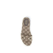 GG canvas SlippersThese Gucci GG canvas Slippers combine elegance and recognizability thanks to the brand’s iconic motif. Embellished with a refined metal horsebit detail on the instep, they feature a round toe for a classic touch. The logo label on the i