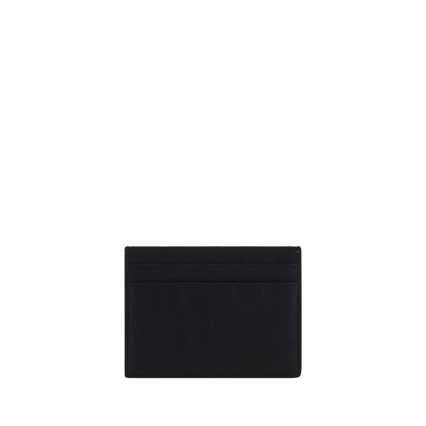Black Lamb Ovis Aries Aries WalletCalfskin Card Holder by Saint Laurent, card slots on front and back, plaque with iconic brand logo embossed on front. Season: AW25 Dimension: 11×11 Composition: 100% Lamb Ovis Aries Aries MADE IN ITALYBlack Lamb Ovis Arie