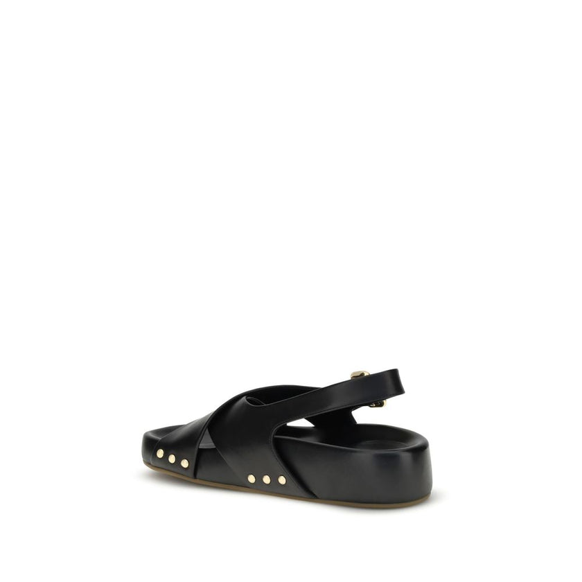 Mae SandalsThe Mae Sandals by Chloé, crafted from smooth calfskin, combine elegance and comfort thanks to the anatomical insole designed to last all day. The upper is characterized by crossed straps and an adjustable ankle strap, secured by the iconic Pad