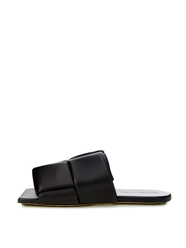 Elegant Black Leather SandalsStep into luxurious simplicity with these elegantly crafted black leather sandals by Bottega Veneta. Perfect for any occasion, they seamlessly blend high-end craftsmanship with sleek design, embodying Italian sophistication. I