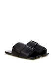Elegant Black Leather SandalsStep into luxurious simplicity with these elegantly crafted black leather sandals by Bottega Veneta. Perfect for any occasion, they seamlessly blend high-end craftsmanship with sleek design, embodying Italian sophistication. I