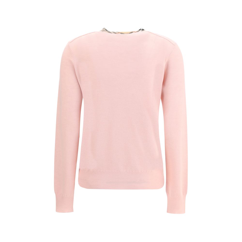 Check collar wool CardiganBurberry’s wool cardigan combines classic elegance with iconic details. Featuring a front button closure, it features a knitted collar and flap with the brand’s signature Check pattern. Ribbed trims complete the design, giving th