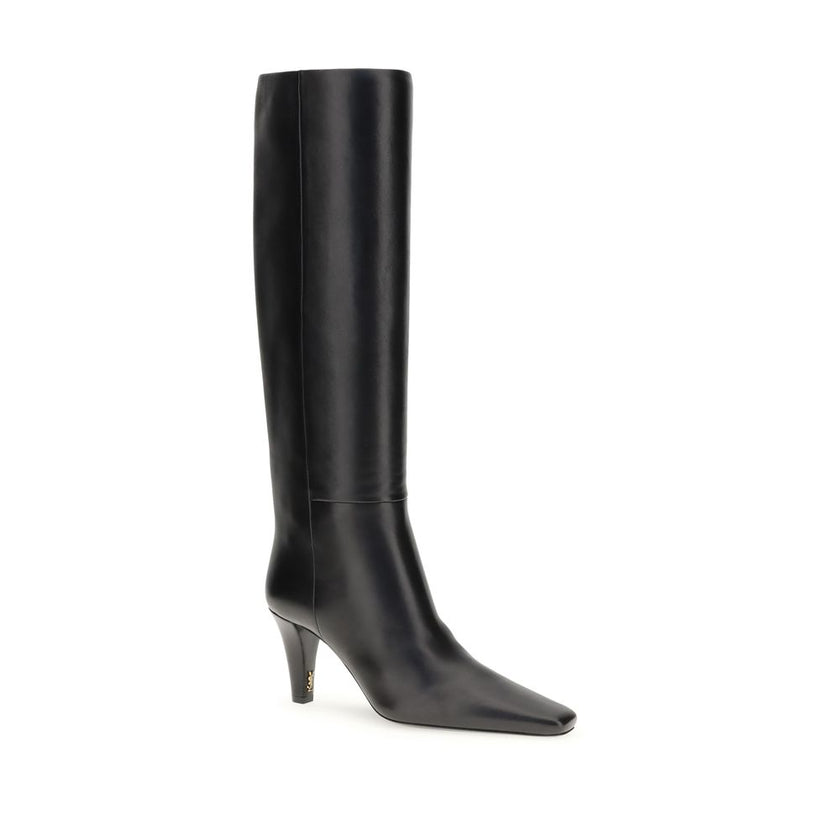 Black Leather High Heel BootsSaint Laurent’s High Leather Boots embody a bold and refined style. With knee-high height and a slightly squared toe, they stand out for their modern, minimalist design. The cone heel adds a touch of character, while the no-lo