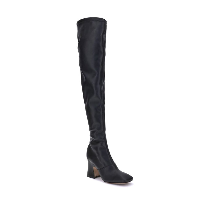 High leather BootsChloé’s High leather Boots stand out for their bold, contemporary design. With a height that reaches mid-thigh, they feature an asymmetrical heel and a squared toe that enhance their modern style. The side zipper ensures a practical and