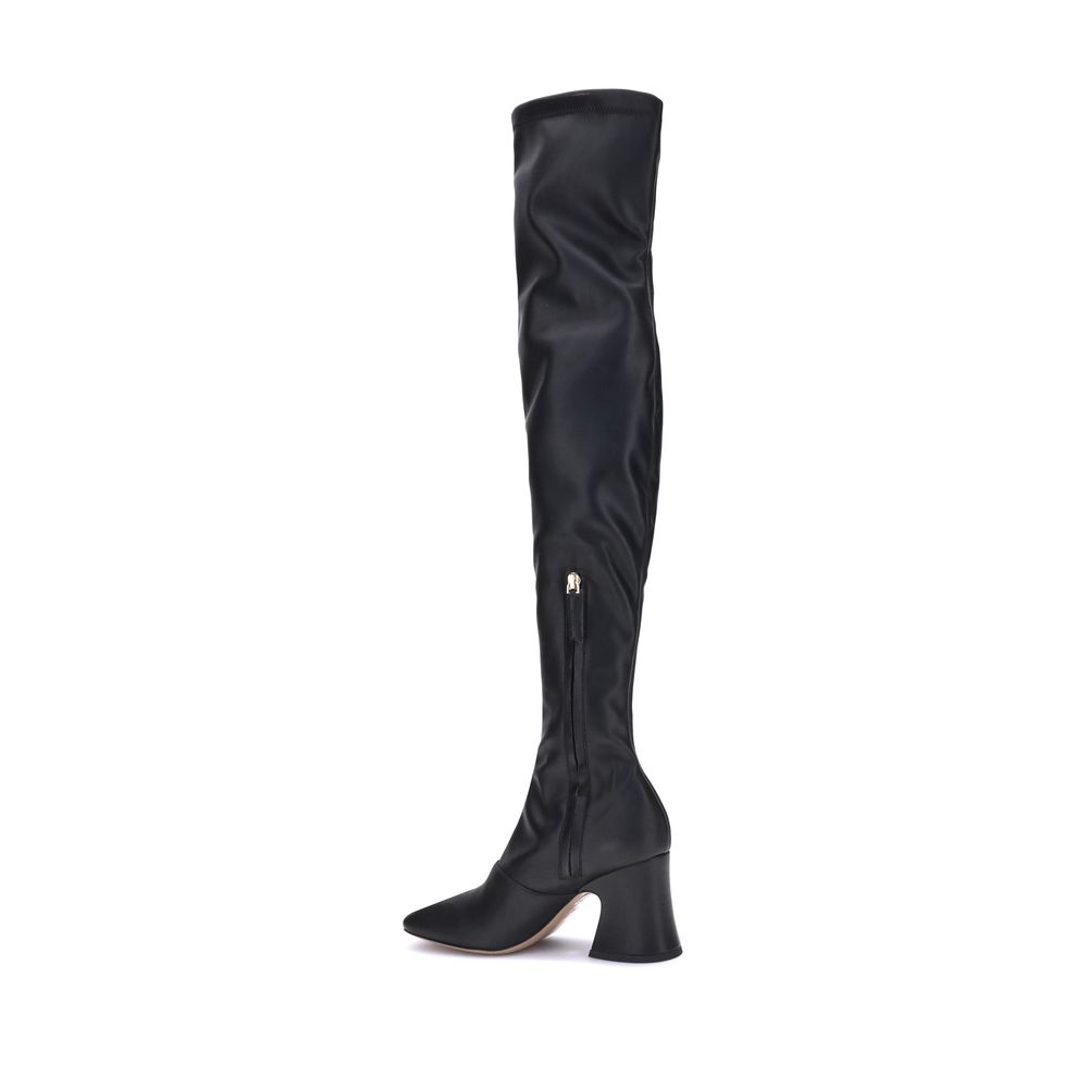 High leather BootsChloé’s High leather Boots stand out for their bold, contemporary design. With a height that reaches mid-thigh, they feature an asymmetrical heel and a squared toe that enhance their modern style. The side zipper ensures a practical and