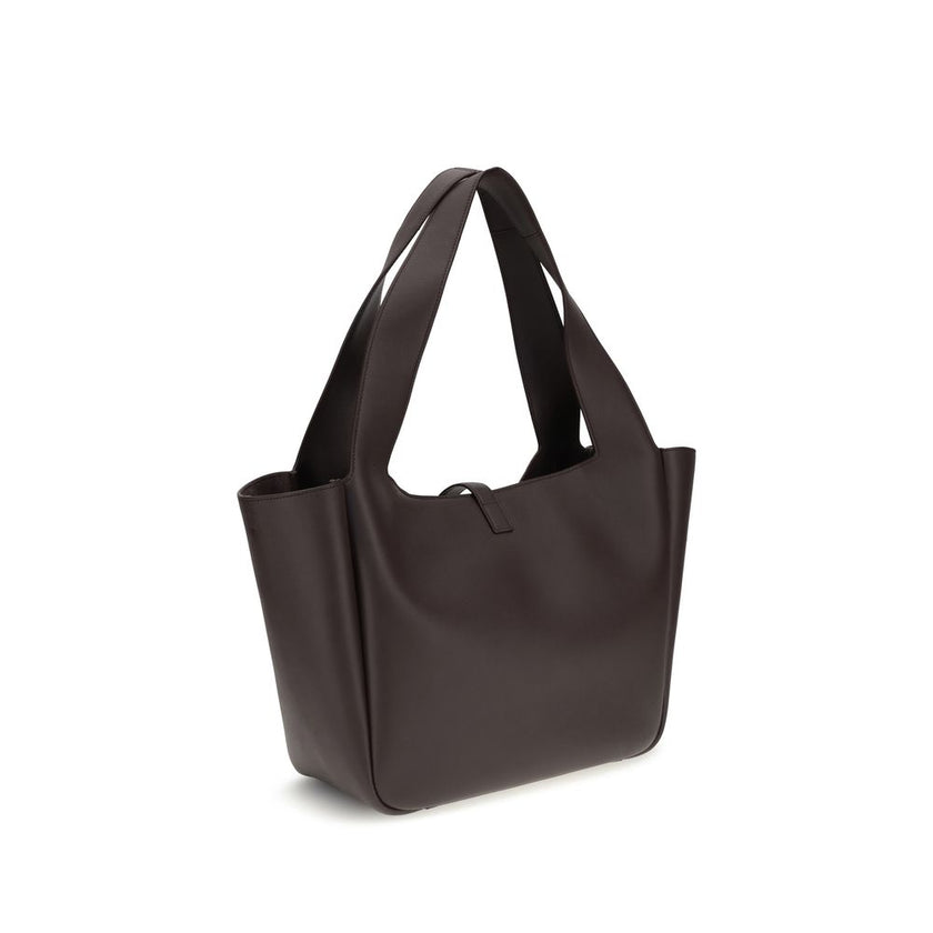 Brown Lamb Ovis Aries Aries Shoulder BagThe Saint Laurent Le 5 à 7 Shoulder Bag is crafted from refined grained leather, featuring a lightweight construction and luxurious tonal suede lining. The East/West design ensures spaciousness and functionality, en