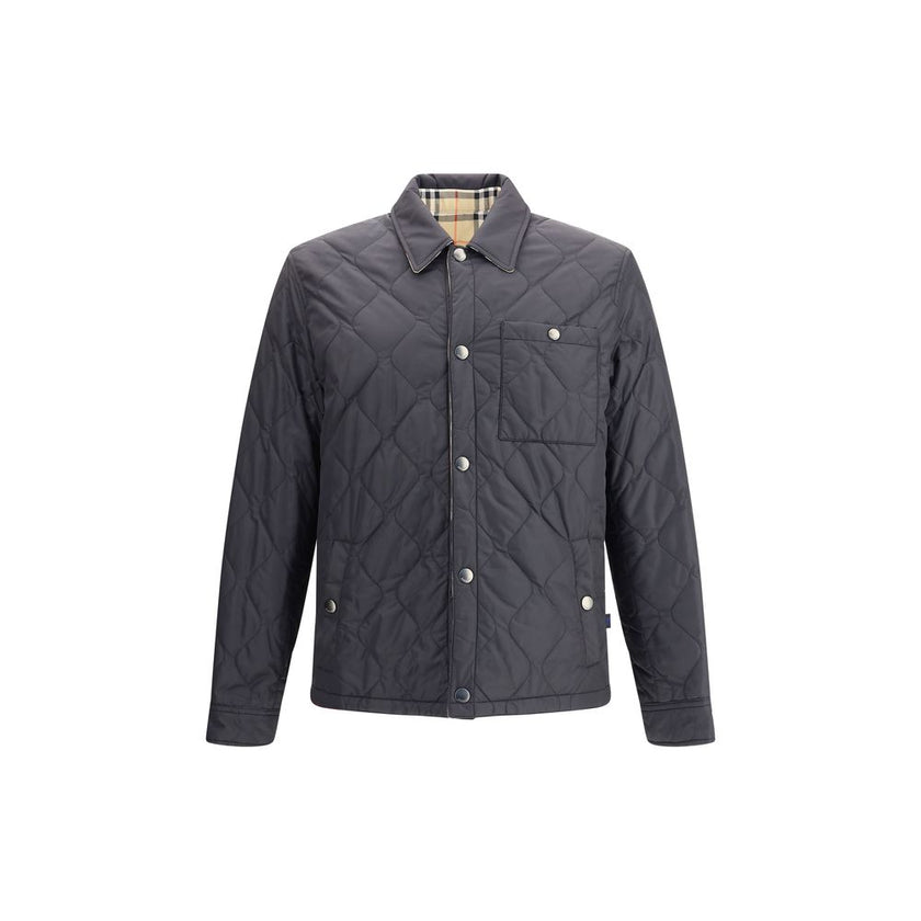 Reversible quilted nylon JacketBurberry’s reversible quilted nylon Jacket combines functionality and distinctive style in one versatile piece. One side features a solid-color quilted nylon fabric, while the other features the classic Burberry Check patter