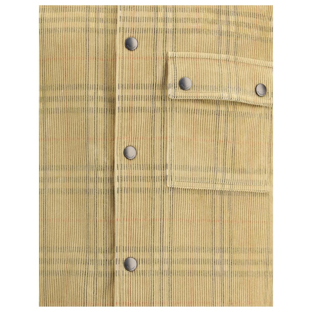 Beige Denim ShirtThis corduroy Shirt featuring Burberry’s iconic Burberry Check combines tradition with contemporary style. Featuring a snap-button closure and a point collar, it also features a snap-button flap chest pocket for a functional touch. Snap-b