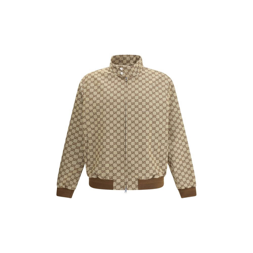 Beige Cotton Shell JacketGucci’s GG Supreme Jacket features a sporty, iconic design with a high collar fastened with snap buttons and a front zipper closure. Two side welt pockets, ribbed hem and cuffs complete the design for a comfortable fit and distinc