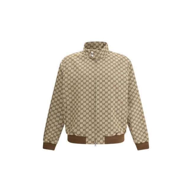 Beige Cotton Shell JacketGucci’s GG Supreme Jacket features a sporty, iconic design with a high collar fastened with snap buttons and a front zipper closure. Two side welt pockets, ribbed hem and cuffs complete the design for a comfortable fit and distinc