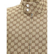 Beige Cotton Shell JacketGucci’s GG Supreme Jacket features a sporty, iconic design with a high collar fastened with snap buttons and a front zipper closure. Two side welt pockets, ribbed hem and cuffs complete the design for a comfortable fit and distinc