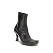 Black Calf Leather Bos Taurus Ankle BootsThe Balenciaga X Scholl Ankle Boots combine style and comfort, crafted from smooth sheepskin with a square toe and internal zip fastening. The upper is embellished with the embossed Scholl and Balenciaga logos, the
