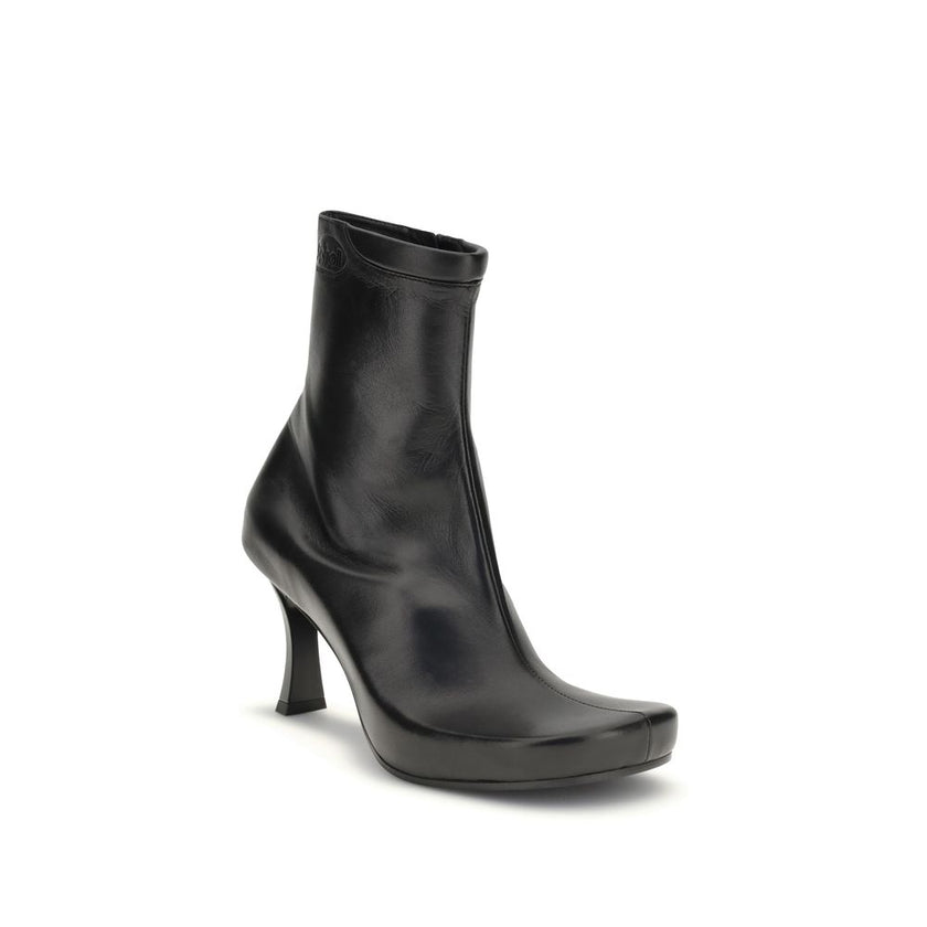 Black Calf Leather Bos Taurus Ankle BootsThe Balenciaga X Scholl Ankle Boots combine style and comfort, crafted from smooth sheepskin with a square toe and internal zip fastening. The upper is embellished with the embossed Scholl and Balenciaga logos, the