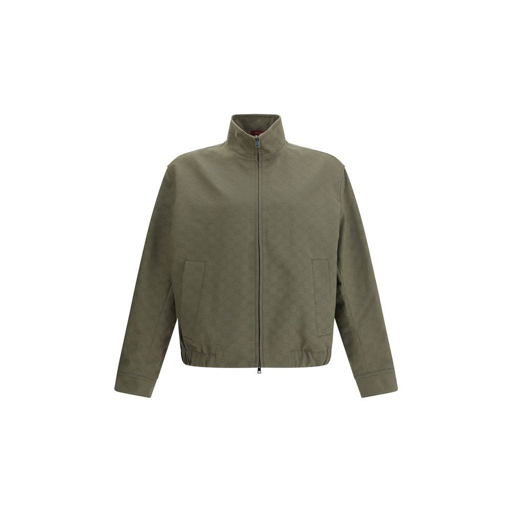 Green Cotton BomberGucci’s GG Supreme Jacket features a sporty, iconic design with a high collar fastened with snaps and a front zipper closure. Two side welt pockets, ribbed hem and cuffs complete the design for a comfortable fit and distinctive style. S