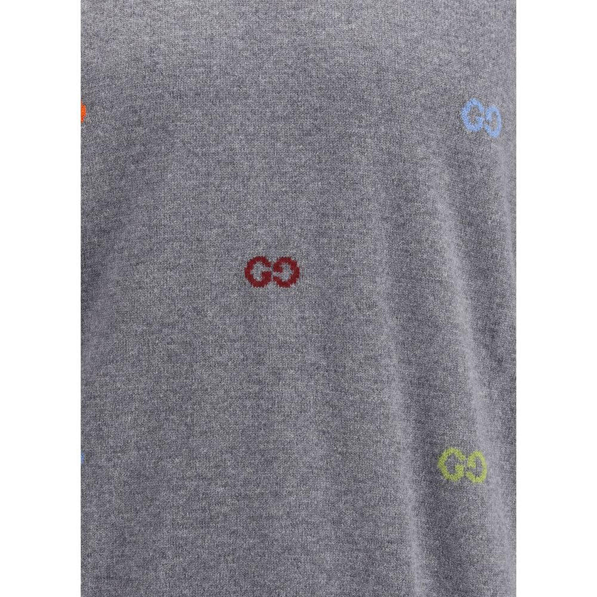 Gray Cashmere SweatshirtGucci’s cashmere Sweater combines bold style and craftsmanship. Made from soft wool, it features a ribbed crew neck, cuffs and hem, and is decorated with the iconic all-over multicolor jacquard logo for a distinctive and recognizab