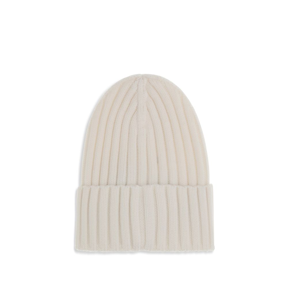 Wool beanie HatMoncler’s wool beanie Hat combines functionality and style in a ribbed design with a modern character. Soft and warm, it is ideal for facing cold days with comfort and personality. A stitched ion logo patch stands out on the front, giving i