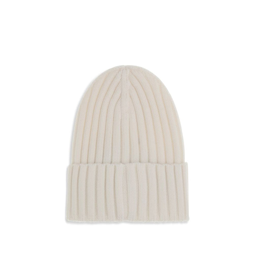 Wool beanie HatMoncler’s wool beanie Hat combines functionality and style in a ribbed design with a modern character. Soft and warm, it is ideal for facing cold days with comfort and personality. A stitched ion logo patch stands out on the front, giving i