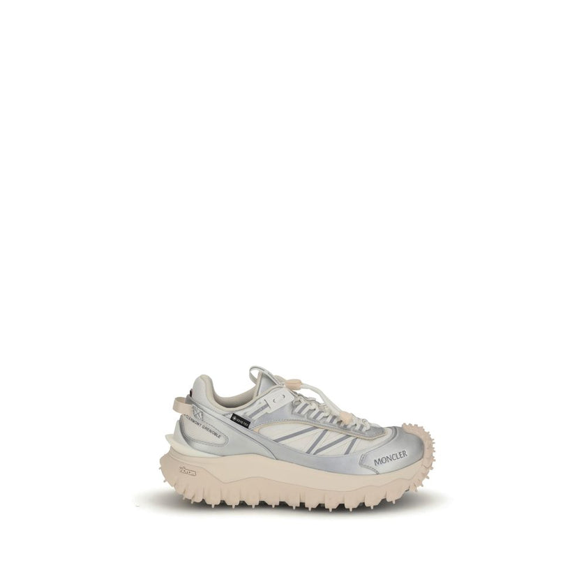 Cream Calf Leather Bos Taurus Athletic SneakersThe Moncler Trailgrip GTX low-top Sneakers combine technical performance and contemporary style. Crafted from fabric and leather with reflective inserts, they feature a logo print on the back and an embossed