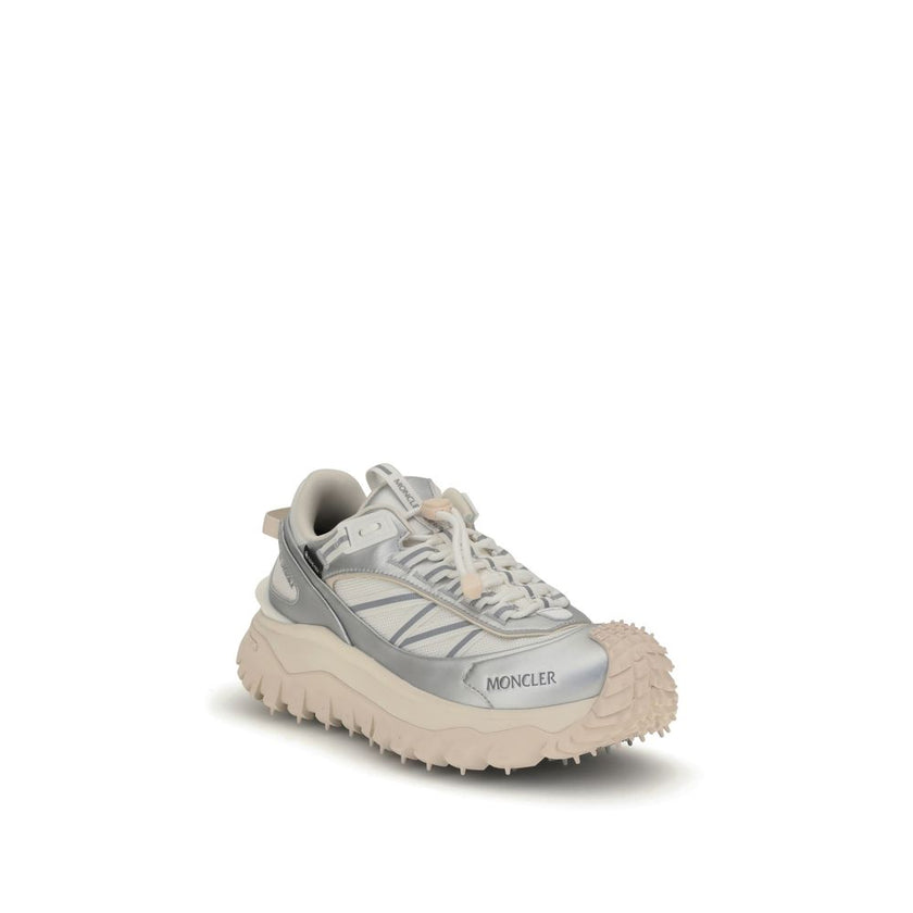 Cream Calf Leather Bos Taurus Athletic SneakersThe Moncler Trailgrip GTX low-top Sneakers combine technical performance and contemporary style. Crafted from fabric and leather with reflective inserts, they feature a logo print on the back and an embossed