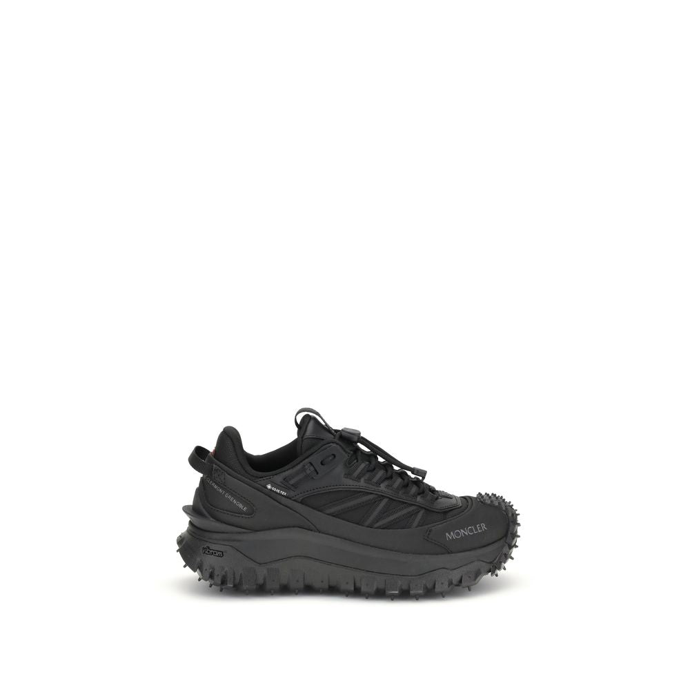 Black Calf Leather Bos Taurus Athletic SneakersThe Moncler Trailgrip GTX low-top Sneakers combine technical performance and contemporary style. Crafted from fabric and leather with reflective inserts, they feature a logo print on the back and an embossed
