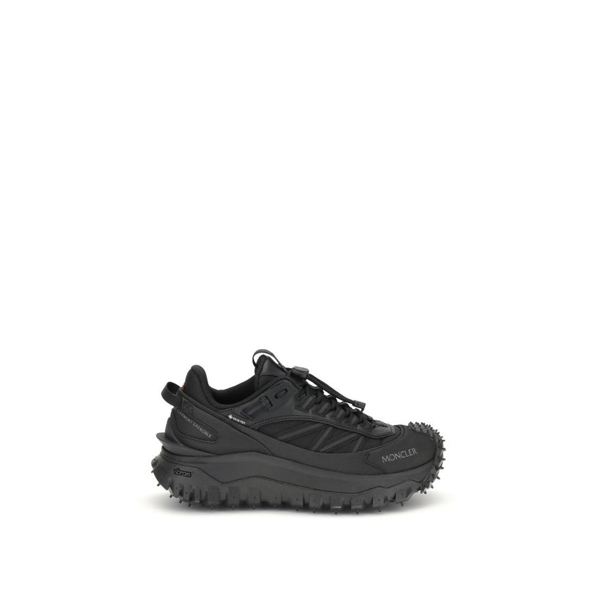 Black Calf Leather Bos Taurus Athletic SneakersThe Moncler Trailgrip GTX low-top Sneakers combine technical performance and contemporary style. Crafted from fabric and leather with reflective inserts, they feature a logo print on the back and an embossed