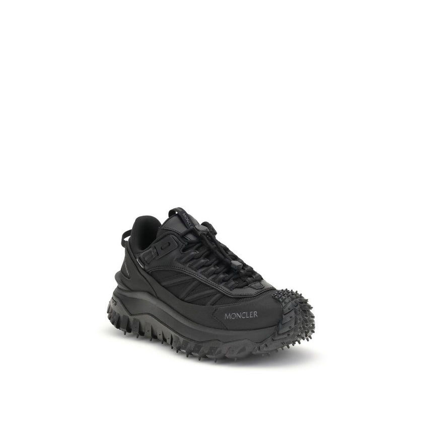 Black Calf Leather Bos Taurus Athletic SneakersThe Moncler Trailgrip GTX low-top Sneakers combine technical performance and contemporary style. Crafted from fabric and leather with reflective inserts, they feature a logo print on the back and an embossed