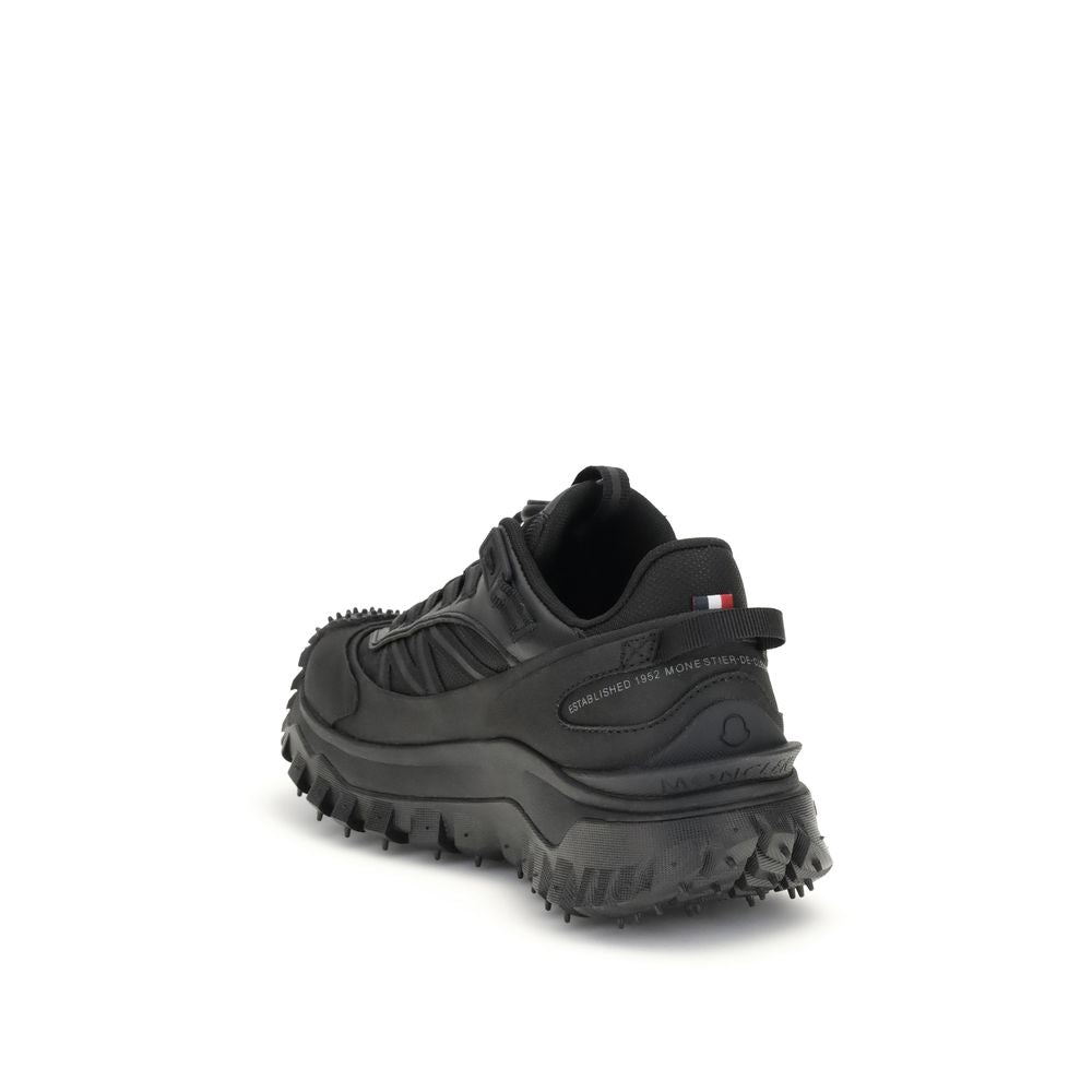 Black Calf Leather Bos Taurus Athletic SneakersThe Moncler Trailgrip GTX low-top Sneakers combine technical performance and contemporary style. Crafted from fabric and leather with reflective inserts, they feature a logo print on the back and an embossed