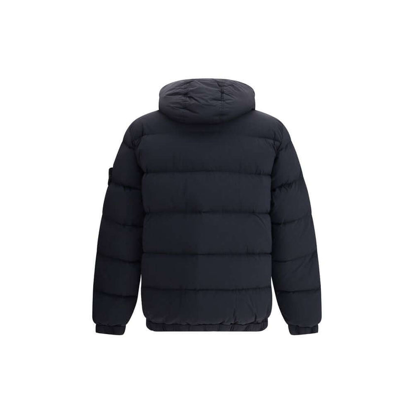 Black Polyamide CoatStone Island’s hooded Down Jacket is made of lightweight, garment-dyed nylon with anti-drip treatment. Featuring a padded hood with horizontal drawstring, it has vertical pockets with contrasting webbing flap, herringbone pattern with