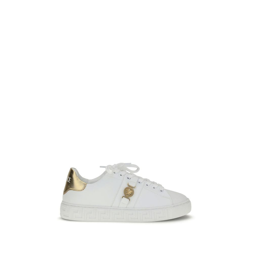 White Calf Leather Bos Taurus Low Top SneakersThe Versace Medusa Sneakers stand out for their iconic Greek key sole and gold heel embellished with the brand’s logo. Featuring a rounded toe and lace-up closure, they also feature an elegant gold Medusa deta