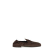 Brown Lamb Ovis Aries Aries Slip-On LoafersPrada’s Shuffle Loafers are made of suede and feature a sleek and contemporary leather horsebit upper. The screen-printed logo adds a refined touch, while the rubber sole with branded logo combines style and func