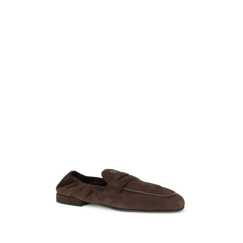 Brown Lamb Ovis Aries Aries Slip-On LoafersPrada’s Shuffle Loafers are made of suede and feature a sleek and contemporary leather horsebit upper. The screen-printed logo adds a refined touch, while the rubber sole with branded logo combines style and func