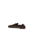 Brown Lamb Ovis Aries Aries Slip-On LoafersPrada’s Shuffle Loafers are made of suede and feature a sleek and contemporary leather horsebit upper. The screen-printed logo adds a refined touch, while the rubber sole with branded logo combines style and func