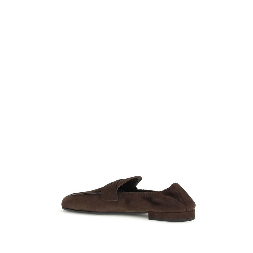 Brown Lamb Ovis Aries Aries Slip-On LoafersPrada’s Shuffle Loafers are made of suede and feature a sleek and contemporary leather horsebit upper. The screen-printed logo adds a refined touch, while the rubber sole with branded logo combines style and func