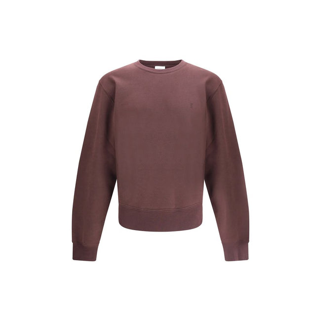 Bordeaux Cotton SweatshirtSaint Laurent’s Cassandre Sweatshirt is a garment with an essential and elegant style. Made with a crew neck and long sleeves, it features ribbed trim and a tone-on-tone Cassandre embroidery on the chest, a discreet but iconic de