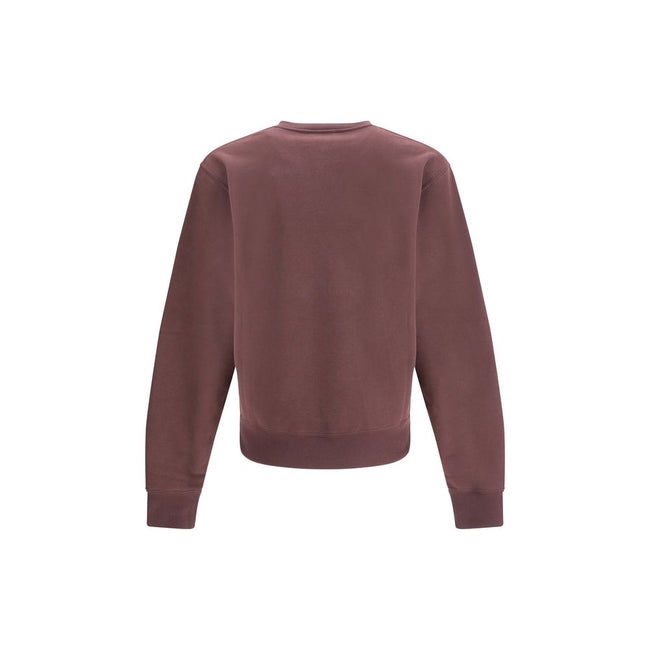 Bordeaux Cotton SweatshirtSaint Laurent’s Cassandre Sweatshirt is a garment with an essential and elegant style. Made with a crew neck and long sleeves, it features ribbed trim and a tone-on-tone Cassandre embroidery on the chest, a discreet but iconic de