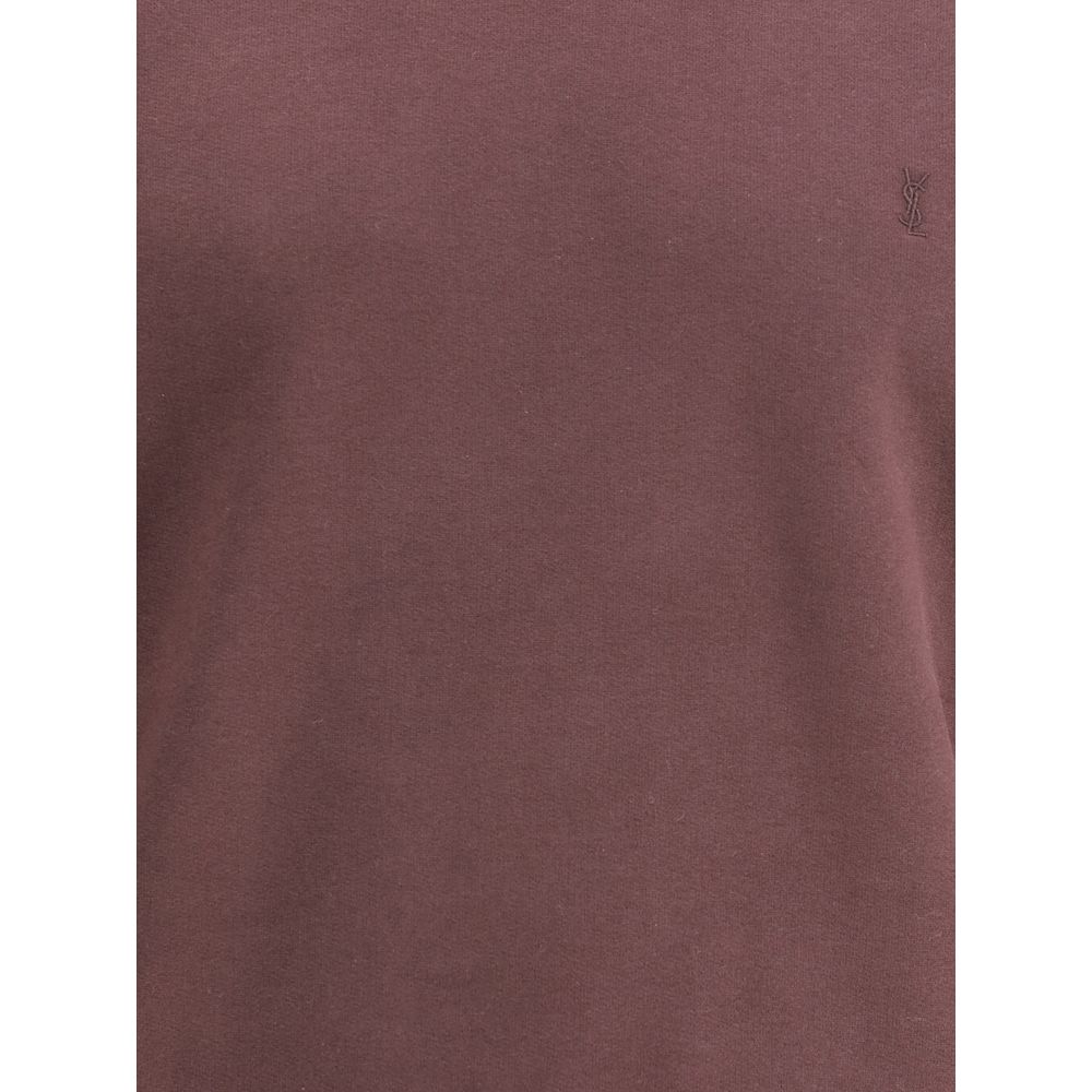Bordeaux Cotton SweatshirtSaint Laurent’s Cassandre Sweatshirt is a garment with an essential and elegant style. Made with a crew neck and long sleeves, it features ribbed trim and a tone-on-tone Cassandre embroidery on the chest, a discreet but iconic de