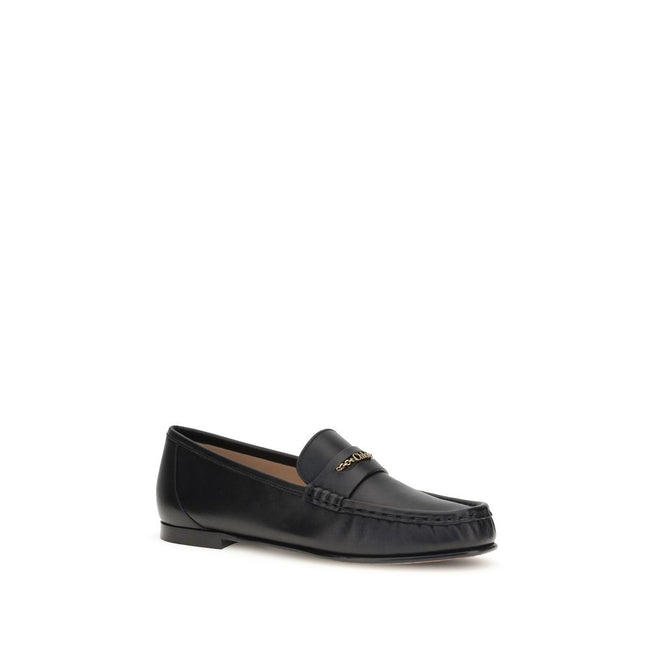 Black Calf Leather Bos Taurus Slip-On LoafersLeather Loafers by Chloé are crafted from fine polished calfskin and feature an elegant silhouette with refined pleated details. The upper is embellished with a subtle gold chain with the Chloé logo, lending a