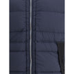 Blue Polyamide Full-Length JacketStone Island’s hooded Down Jacket is made of lightweight, garment-dyed nylon with anti-drip treatment. Featuring a padded hood with horizontal drawstring, it has vertical pockets with contrasting webbing flap, herringbone