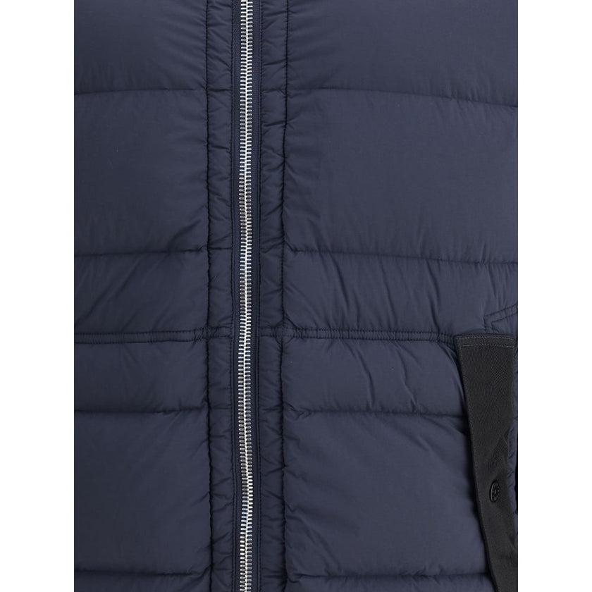 Blue Polyamide Full-Length JacketStone Island’s hooded Down Jacket is made of lightweight, garment-dyed nylon with anti-drip treatment. Featuring a padded hood with horizontal drawstring, it has vertical pockets with contrasting webbing flap, herringbone