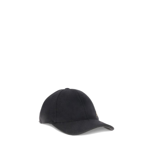 Wool Baseball CapSaint Laurent’s wool baseball Cap combines sportiness and iconic style. Made of soft wool, it features a classic silhouette with an adjustable back for a customized fit. On the front, the applied YSL plaque lends a distinctive and sophist