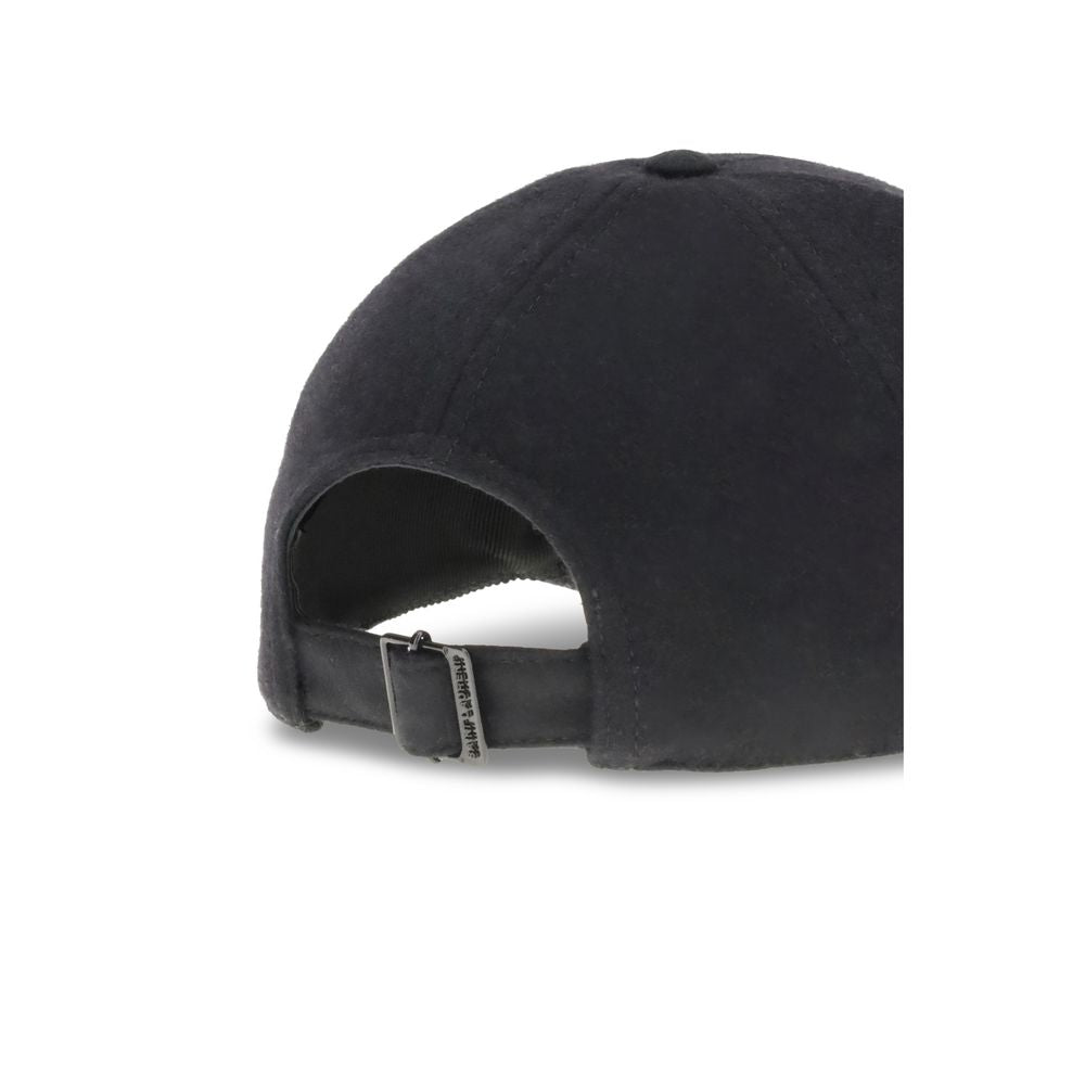 Wool Baseball CapSaint Laurent’s wool baseball Cap combines sportiness and iconic style. Made of soft wool, it features a classic silhouette with an adjustable back for a customized fit. On the front, the applied YSL plaque lends a distinctive and sophist
