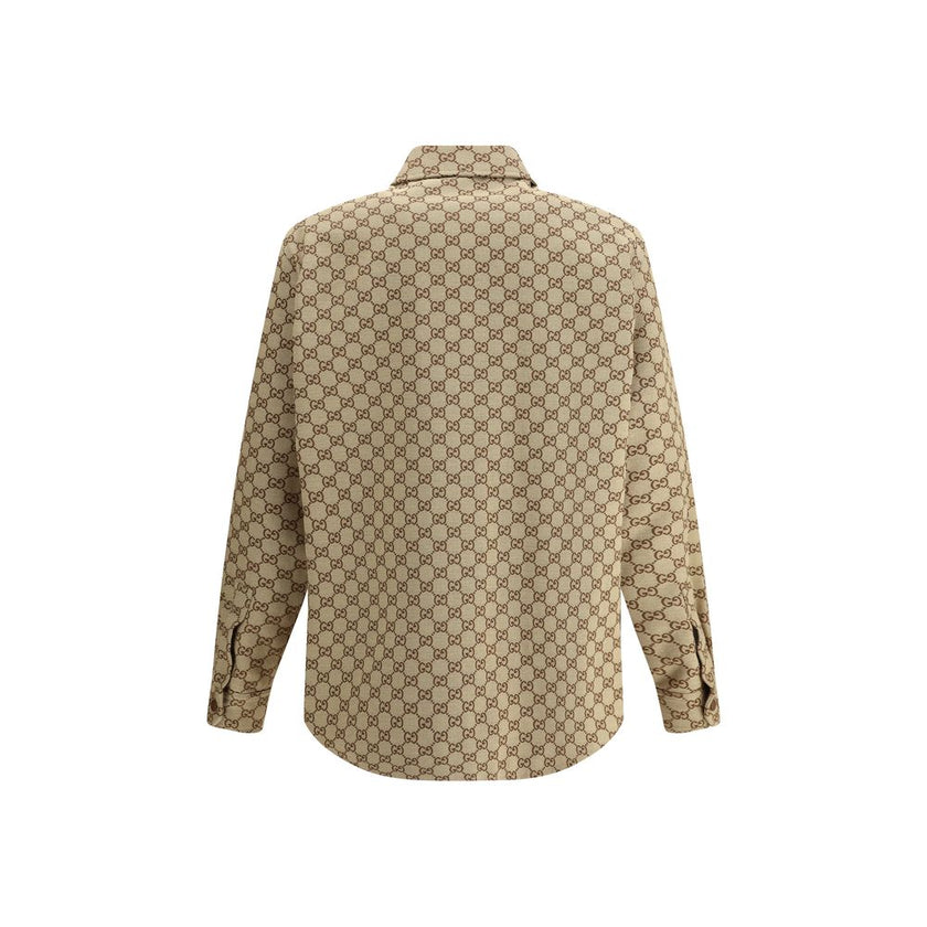 Brown Cotton Jackets And CoatThe Gucci cotton Jacket is a refined and modern piece, perfect for a casual-chic look. The shirt style offers a versatile fit, while the classic collar adds a touch of elegance. The front zip closure ensures practicality and a