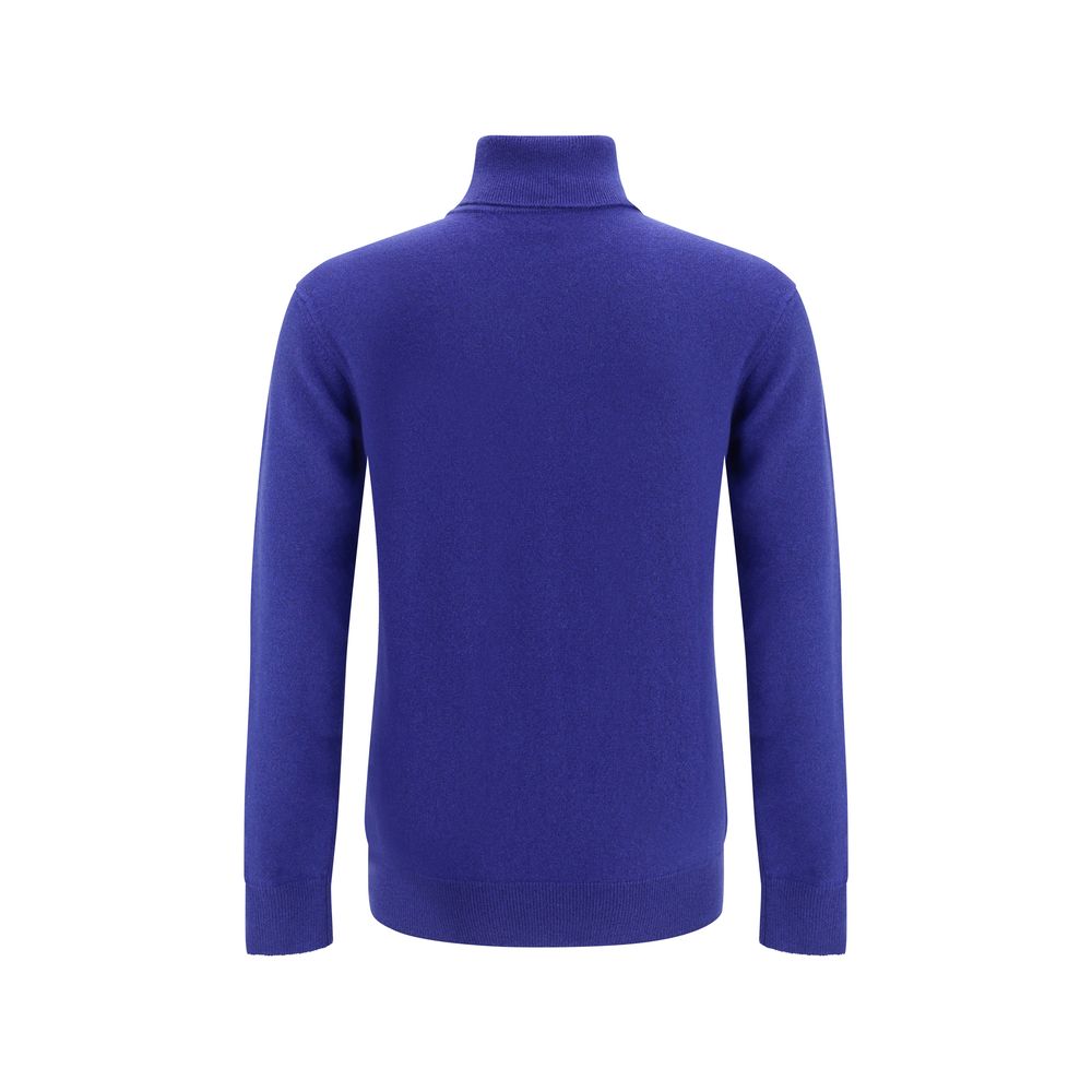Blue Cashmere Cashmere SweaterThe Saint Laurent turtleneck Sweater is an iconic garment with an understated and refined style. Featuring a ribbed high collar, it features cuffs and hem that are also ribbed, defining its structure and ensuring a comfortabl