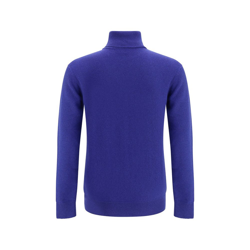 Blue Cashmere Cashmere SweaterThe Saint Laurent turtleneck Sweater is an iconic garment with an understated and refined style. Featuring a ribbed high collar, it features cuffs and hem that are also ribbed, defining its structure and ensuring a comfortabl